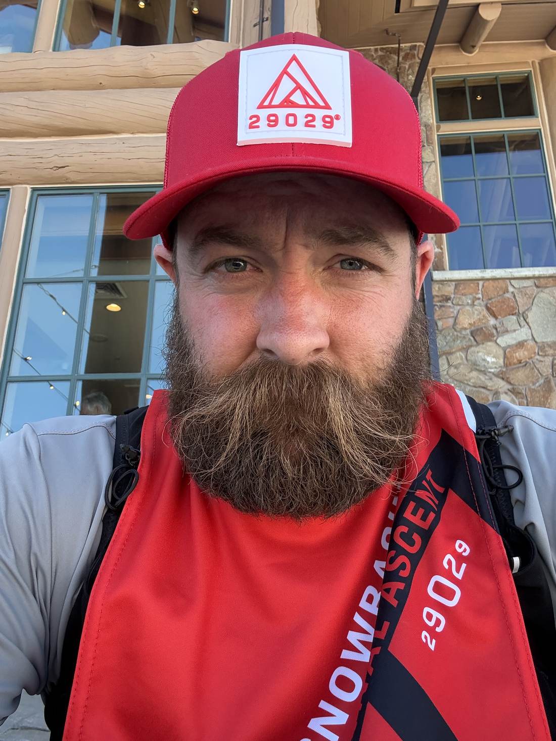 Bruce after finishing, in the red 29029 hat and Snowbasin ascent finisher shirt